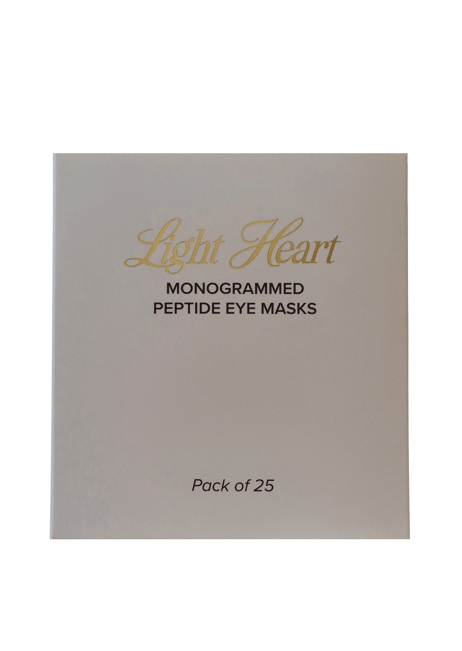 Pack of 25 monogrammed peptide eye masks by Light Heart on a beige background