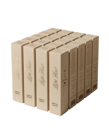 Light Heart Lashes Growth Serum boxes stacked in bulk — lash growth serum packaging in cream and gold